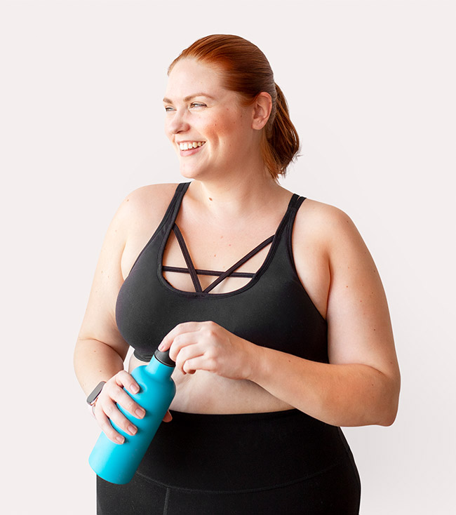 Photo of slightly heavy woman wearing black workout clothes